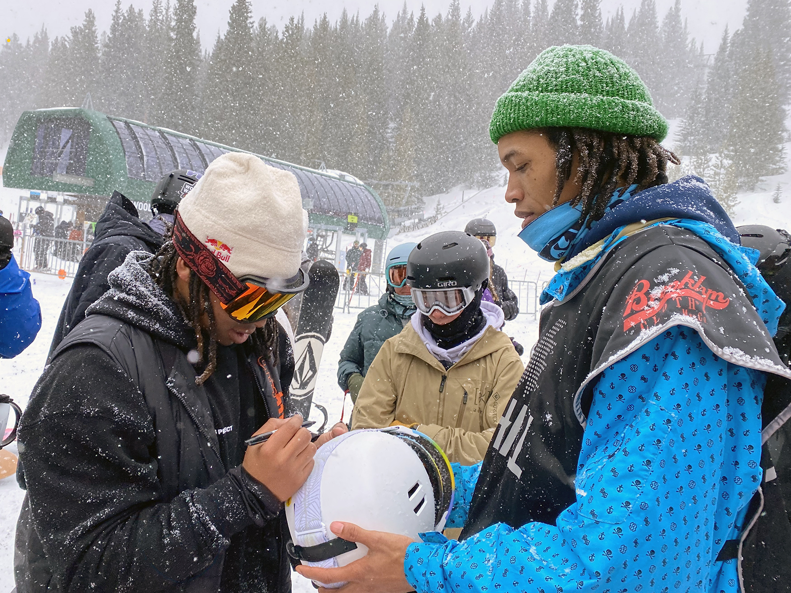 Zeb Powell signs an autograph for Deonte Westcott at the Red Bull Slide-In Tour at Copper Mountain.