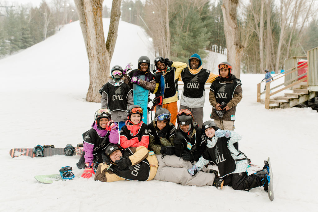 A group at Chill snow program, posing with their agency lead.